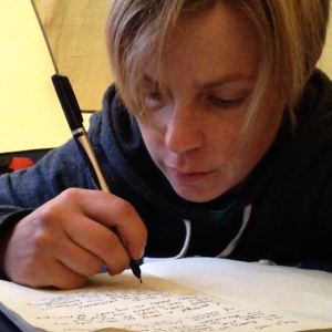 Reflecting on life in my journal.